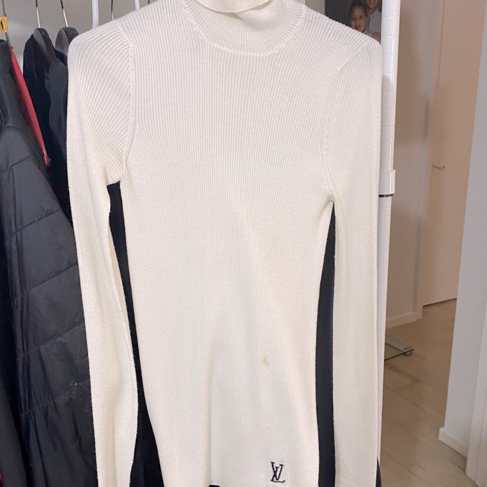 Louis Vuiton turtleneck and blue shiny damier suit